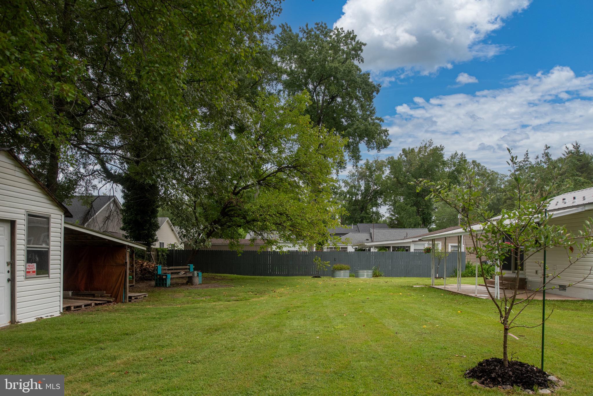 161 8th Street Colonial Beach, VA 22443 - Photo 57 of 71 a backyard of a house with lots of green space