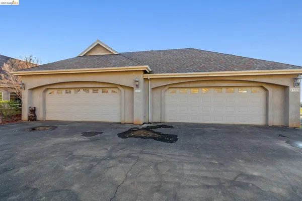 a front view of a house with a garage