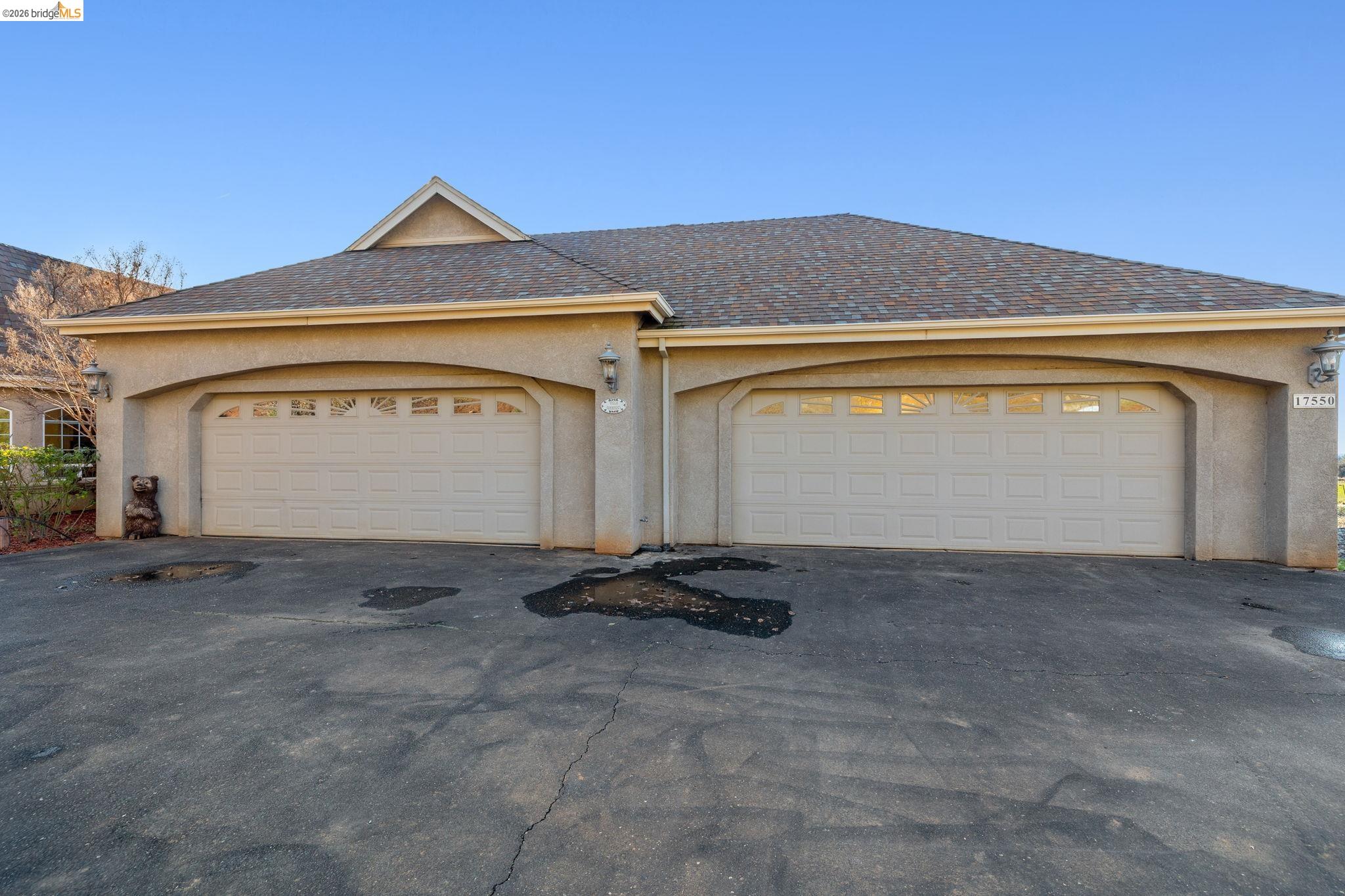 a front view of a house with a garage