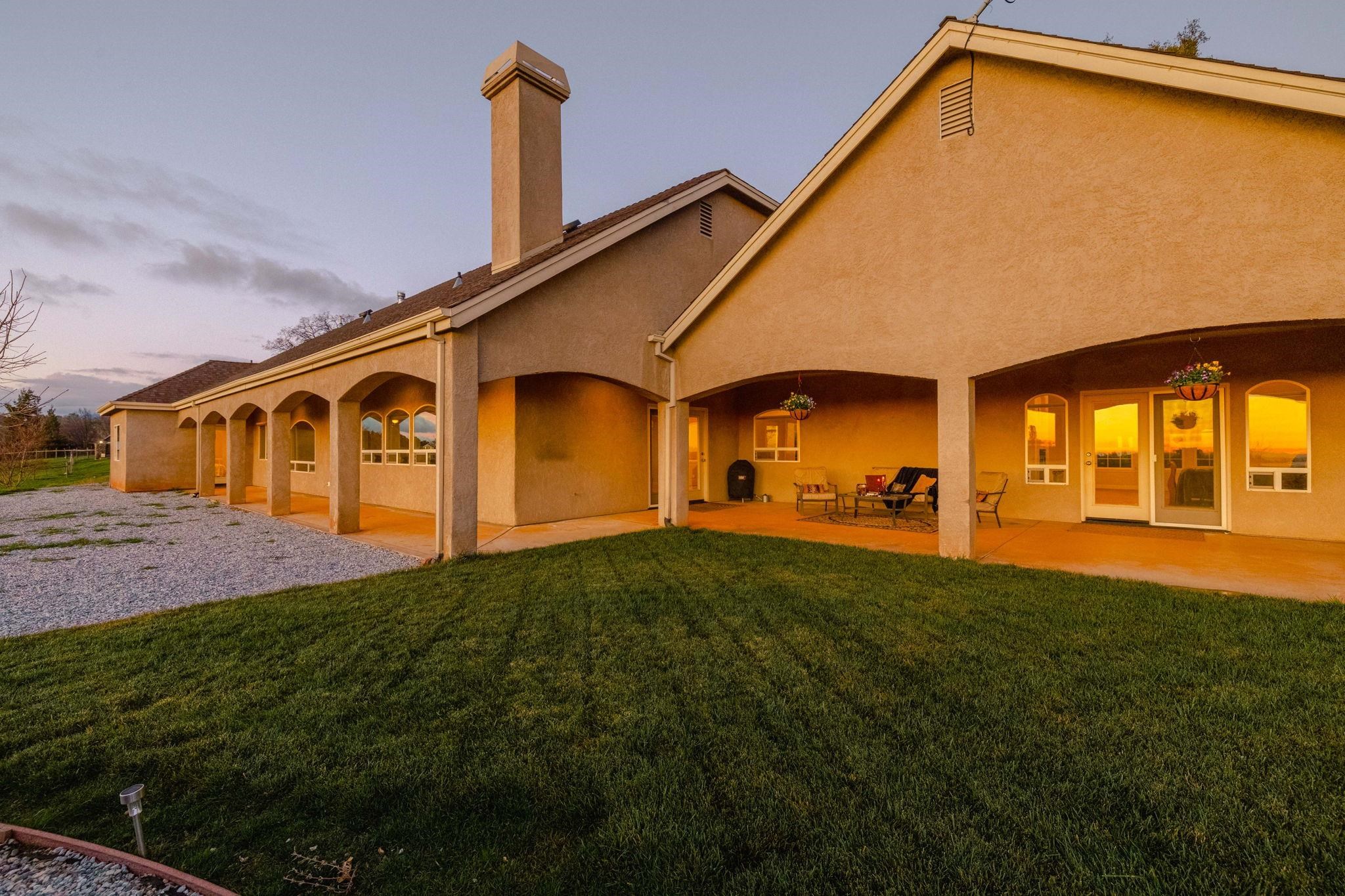 17550 Old Wards Ferry Road Sonora, CA 95370 - Photo 42 of 59 Rear view of property with stucco siding, a yard, a patio, and a chimney