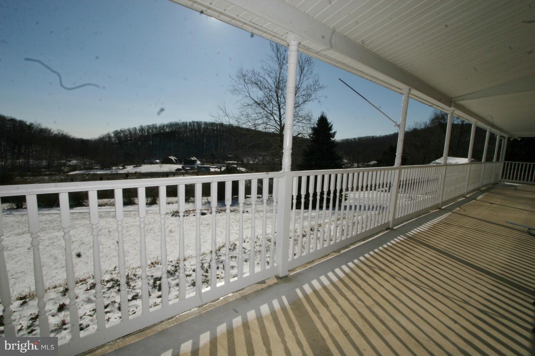 13102 Draper Road Clear Spring, MD 21722 - Photo 25 of 26 a view of a house with a wooden deck