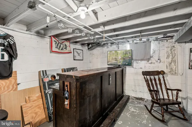 a living room with furniture and a kitchen