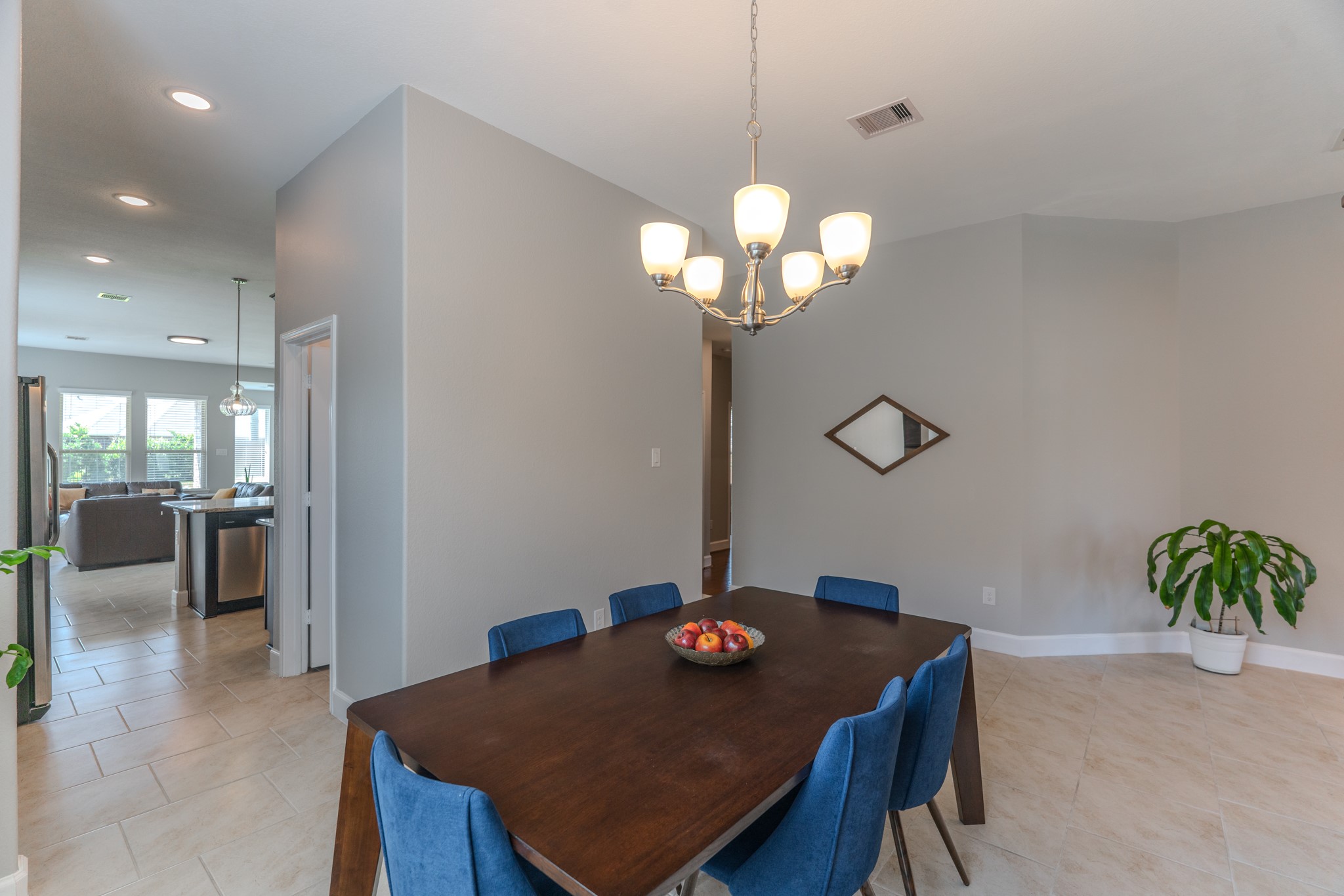 24322 North Newcastle Bay Trail Spring, TX 77389 - Photo 12 of 50 a view of a dining room with furniture and chandelier