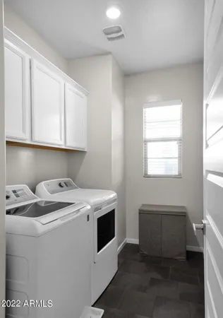 a utility room with washer and dryer