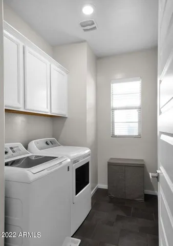 a utility room with washer and dryer