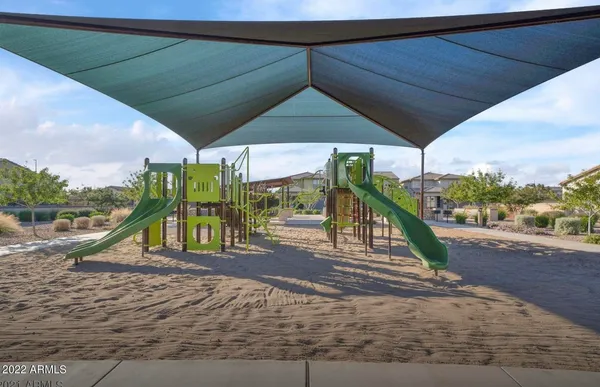 a view of a wooden deck with a yard