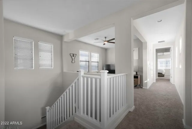 a view of a hallway with windows