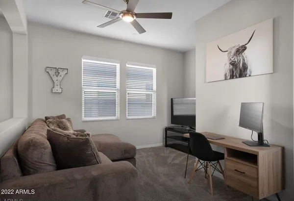 a living room with furniture and a window