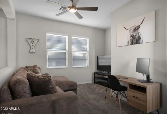 a living room with furniture and a window