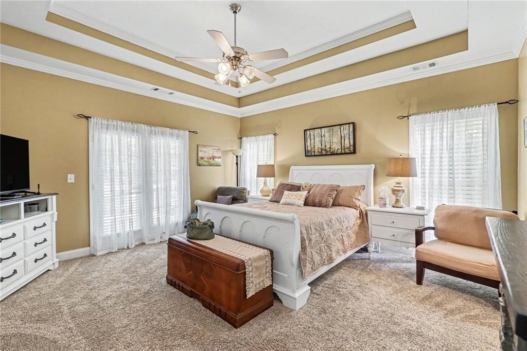 3792 Falls Trail Winston, GA 30187 - Photo 13 of 33 a spacious bedroom with a bed a couch and dresser