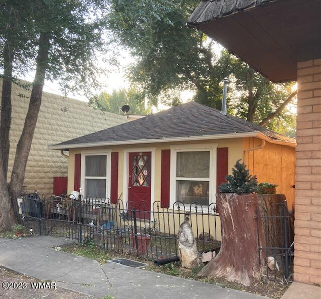24 South 1st W Street Snowflake, AZ 85937 - Photo 1 of 1 a view of a house with a small yard and wooden fence