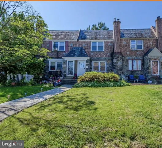 front view of a building with a garden