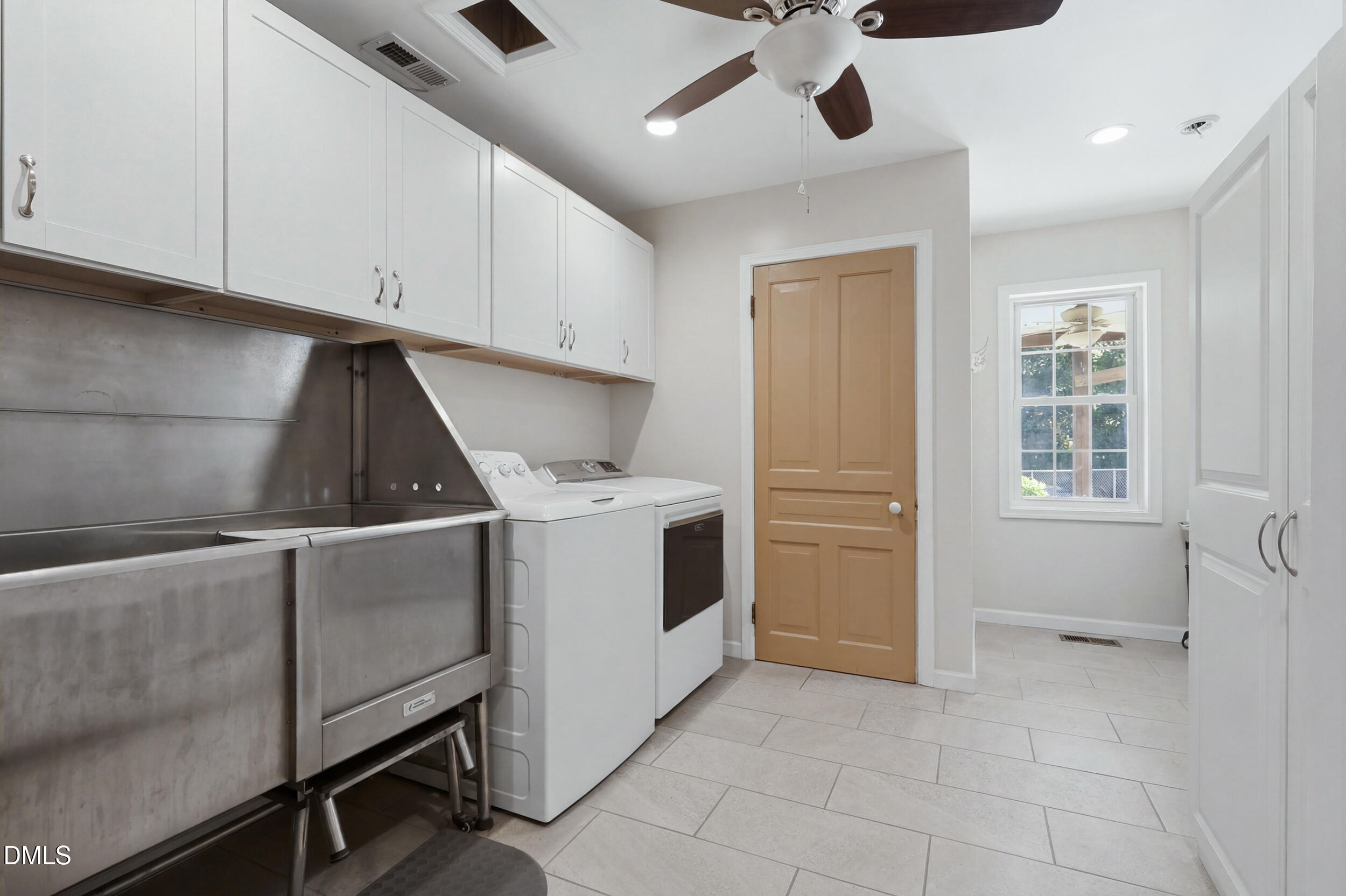 2631 South Jim Minor Road Haw River, NC 27258 - Photo 37 of 62 a utility room with cabinets dryer and washer
