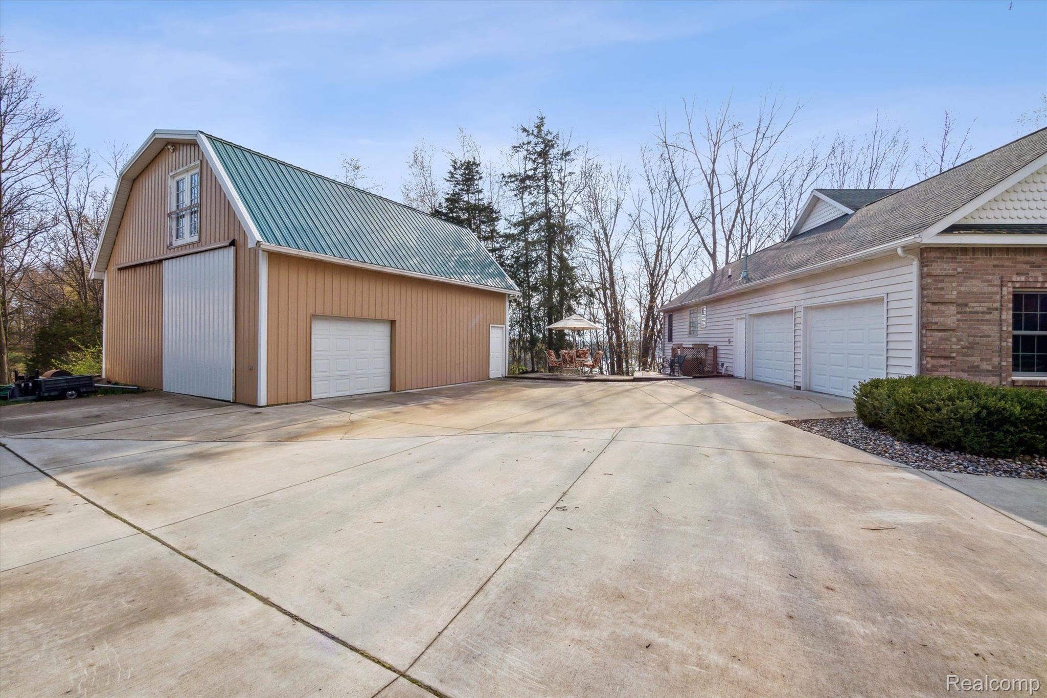 2659 West Coon Lake Road Howell, MI 48843 - Photo 39 of 45 2-car attached garage and 32x32 pole barn