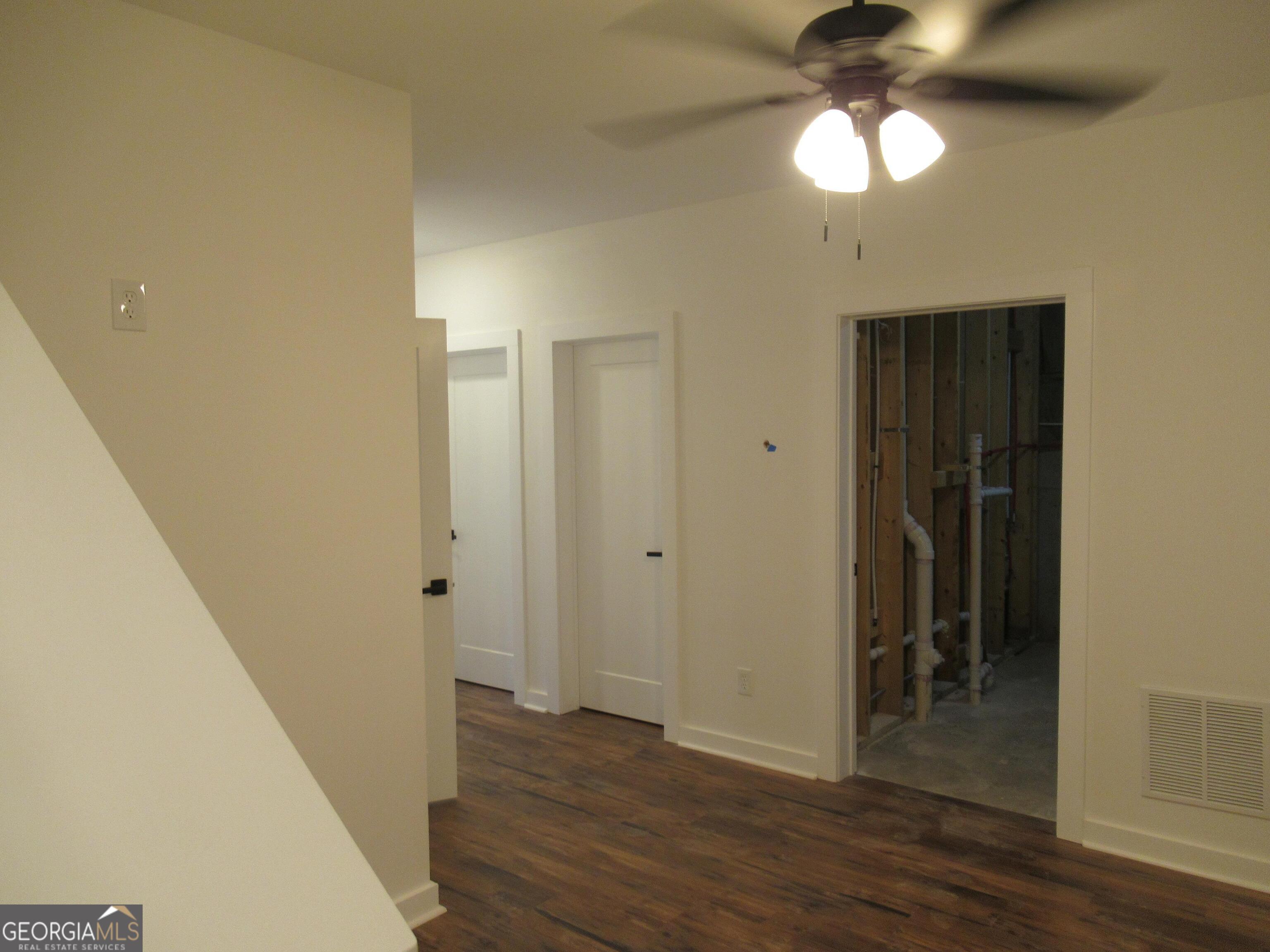 765 Old Kerns Road Dawsonville, GA 30534 - Photo 30 of 36 a view of a hallway with wooden floor