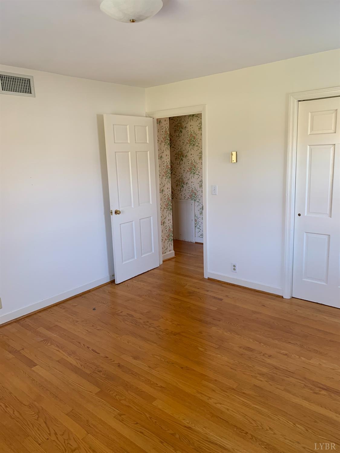 336 North Main Street Amherst, VA 24521 - Photo 19 of 60 a view of an empty room and wooden floor