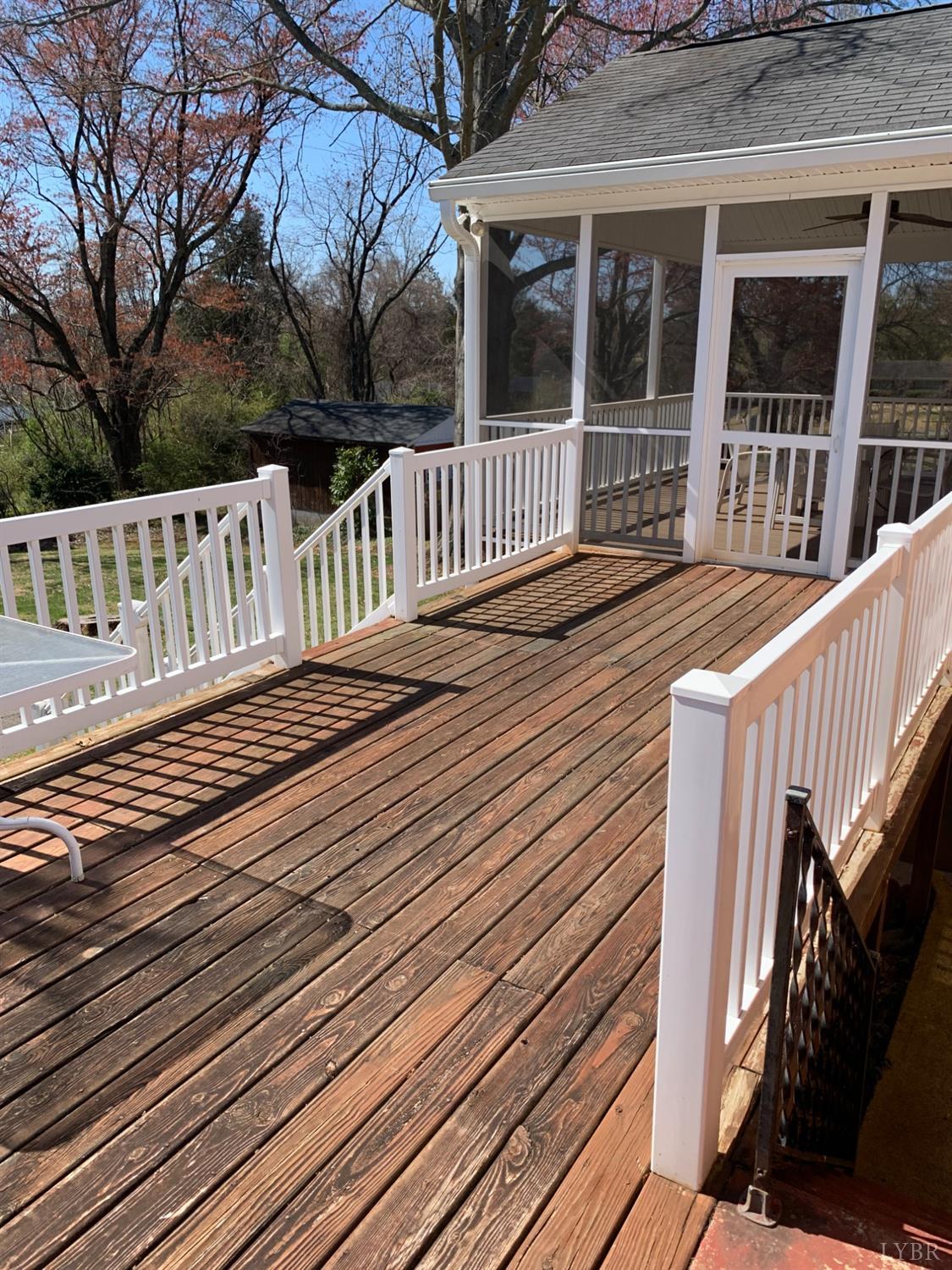 336 North Main Street Amherst, VA 24521 - Photo 36 of 60 a view of deck with wooden floor and fence and a floor to ceiling window