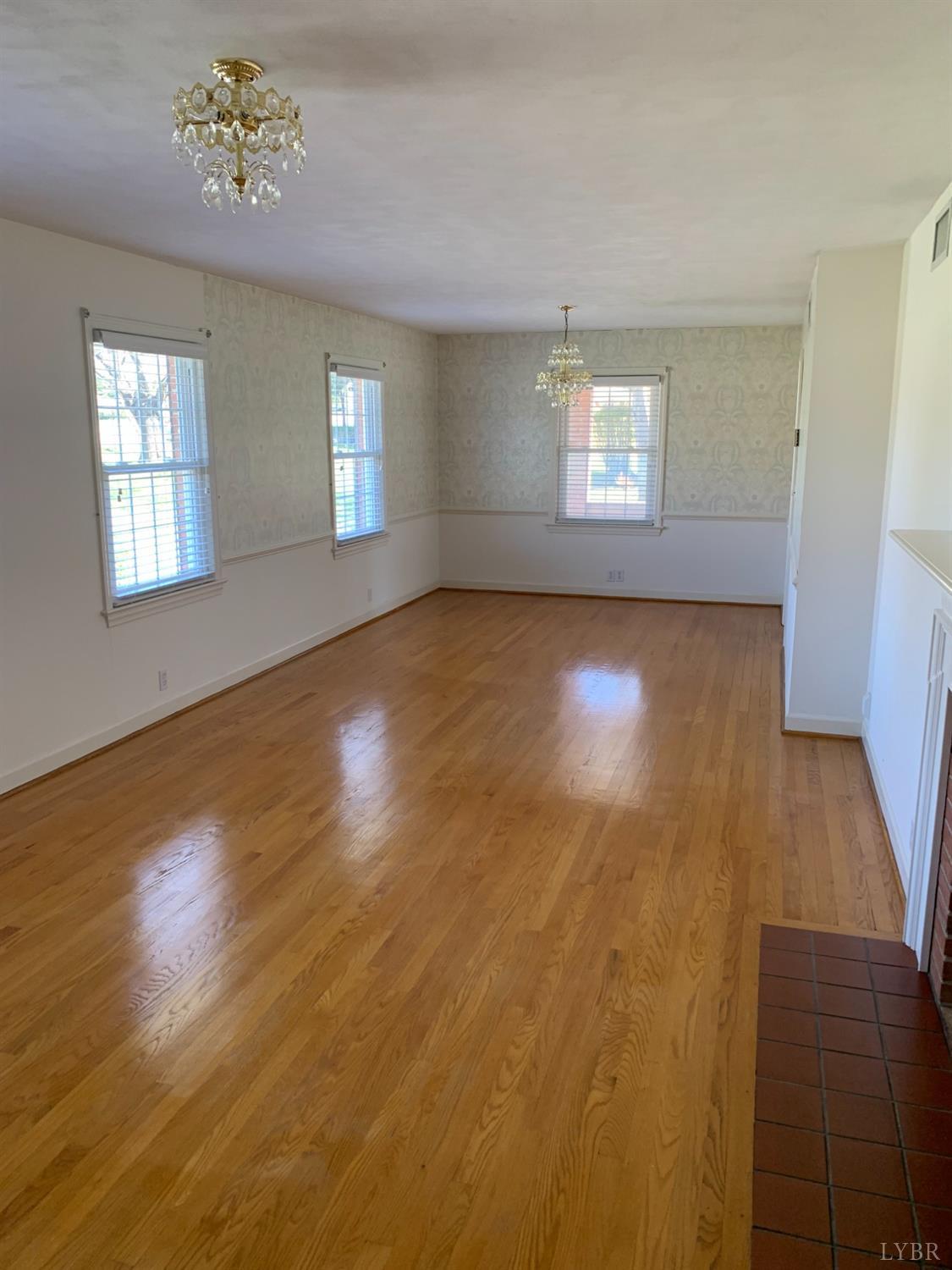 336 North Main Street Amherst, VA 24521 - Photo 8 of 60 wooden floor in an empty room with a window