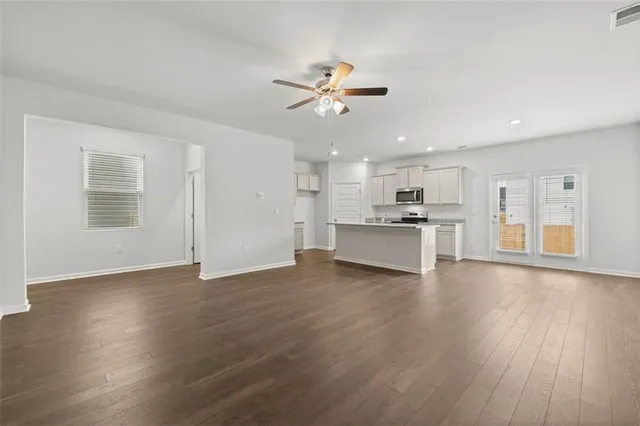 a kitchen with a sink and a stove top oven