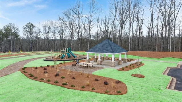 a view of a swimming pool with a yard