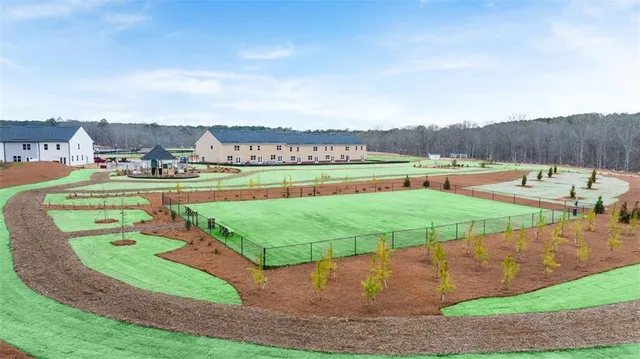 a swimming pool view with a outdoor seating