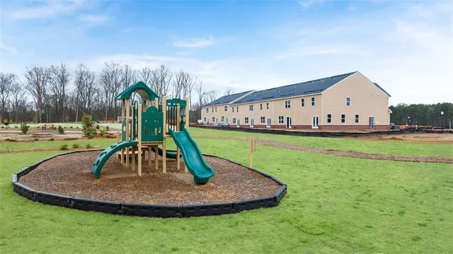 a view of a park with large trees