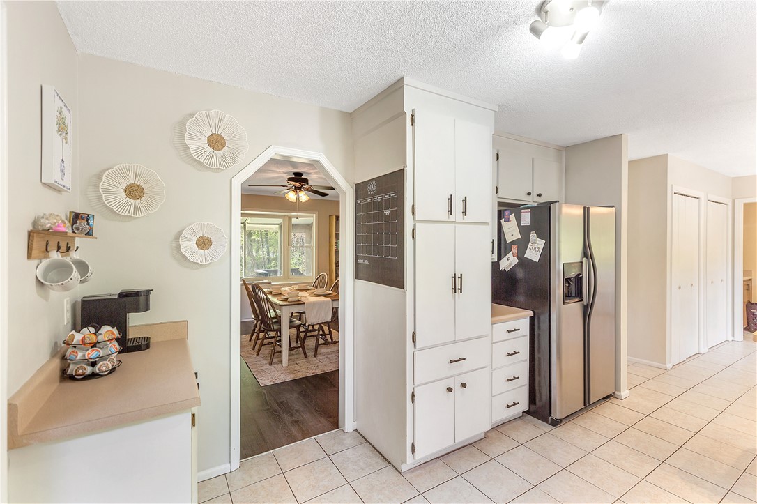 102 Rockingham Road Seneca, SC 29672 - Photo 12 of 39 This spacious kitchen offers ample storage, seamlessly connecting to a cozy dining area.
