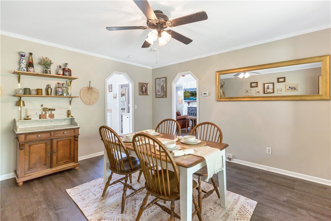 102 Rockingham Road Seneca, SC 29672 - Photo 13 of 39 This inviting dining area features crown molding, wood flooring, and ample natural light.