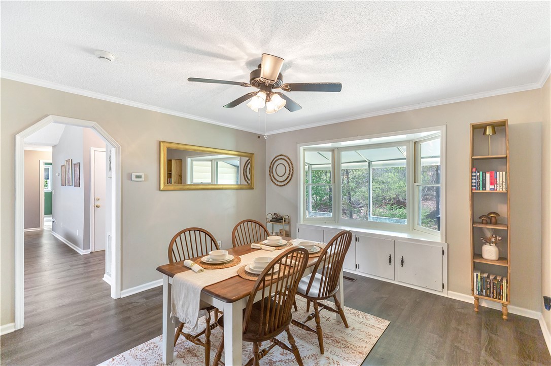 102 Rockingham Road Seneca, SC 29672 - Photo 14 of 39 This bright dining area features an elegant bay window, creating an inviting space for gatherings.