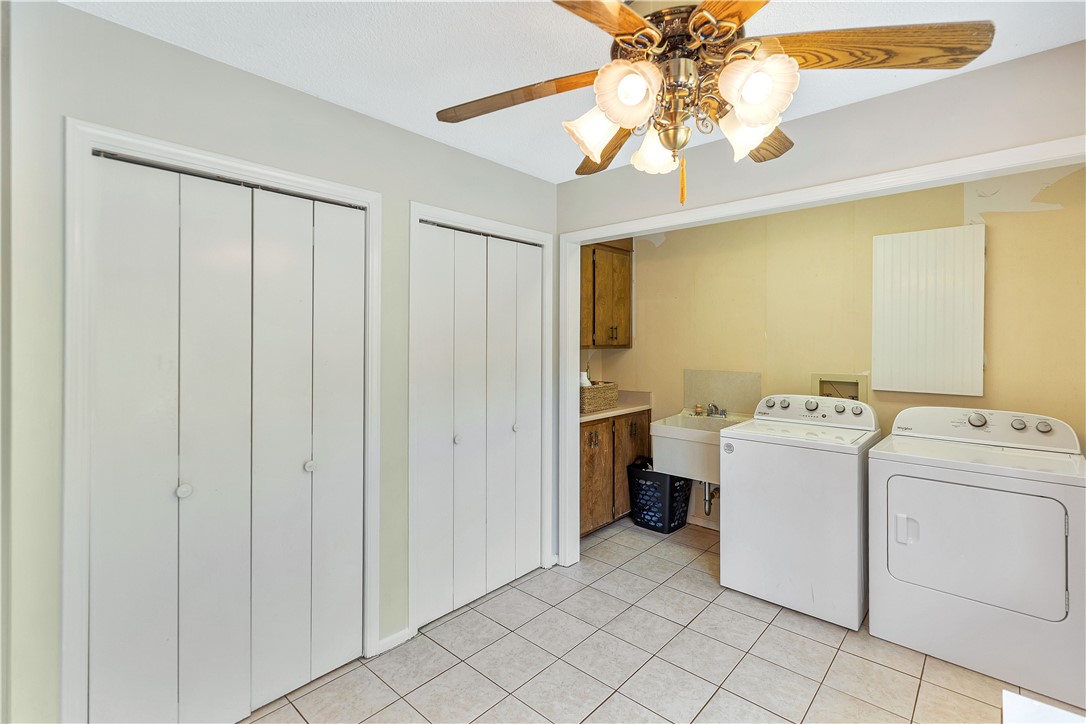102 Rockingham Road Seneca, SC 29672 - Photo 17 of 39 This laundry room features ample storage and a functional layout, perfect for daily tasks.