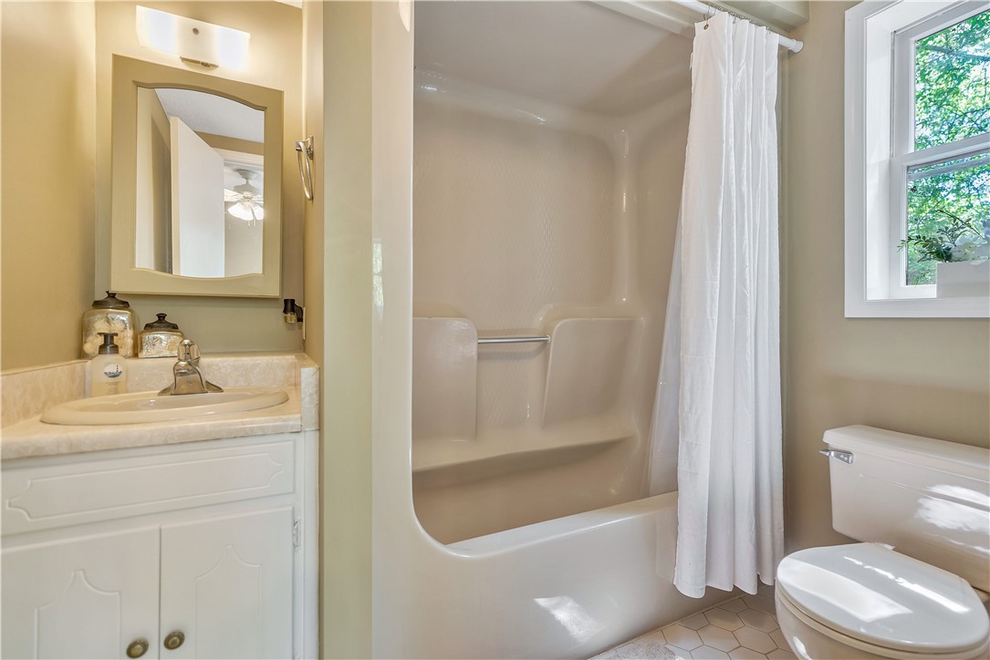 102 Rockingham Road Seneca, SC 29672 - Photo 19 of 39 This clean and inviting bathroom features a convenient shower and practical vanity.