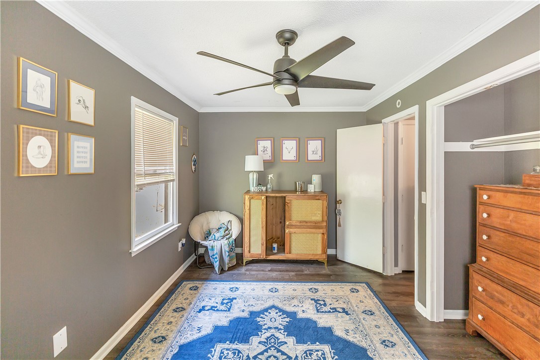102 Rockingham Road Seneca, SC 29672 - Photo 21 of 39 This cozy bedroom features a stylish ceiling fan, ample natural light, and elegant crown molding.