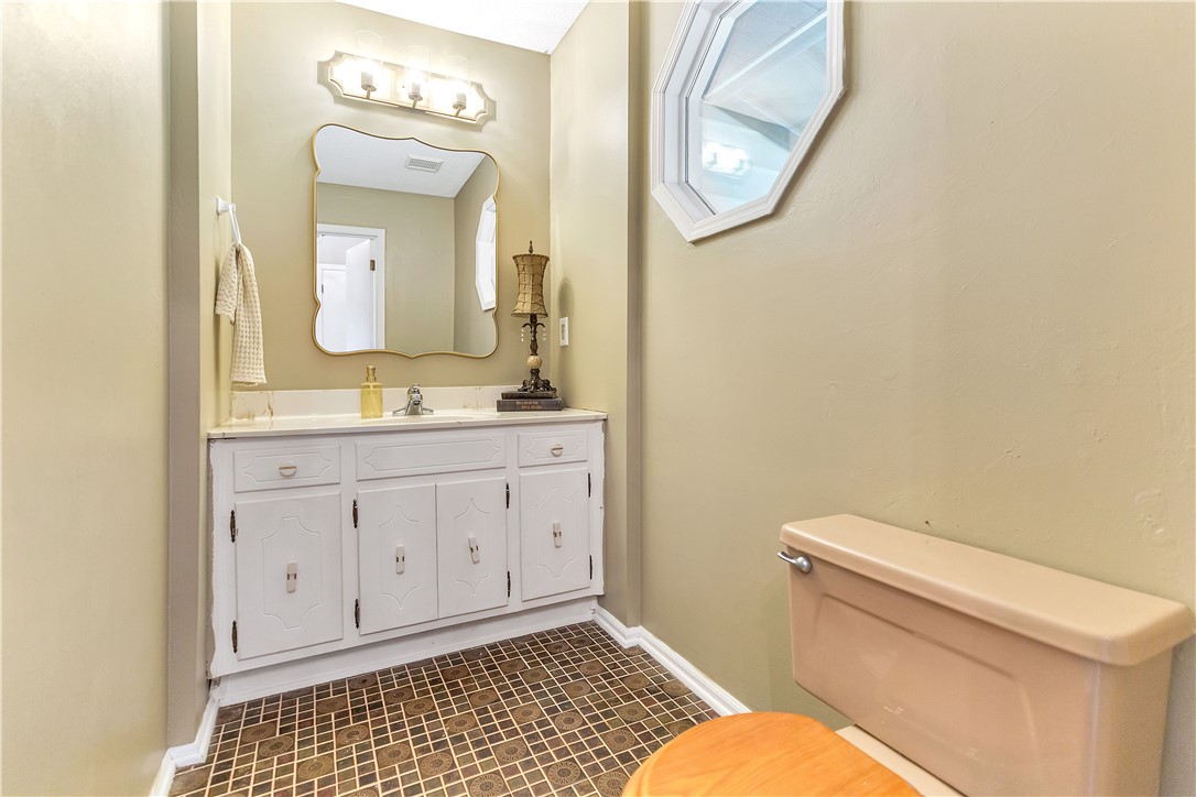 102 Rockingham Road Seneca, SC 29672 - Photo 23 of 39 A well-appointed bathroom features a practical vanity with ample storage and a unique window accent.