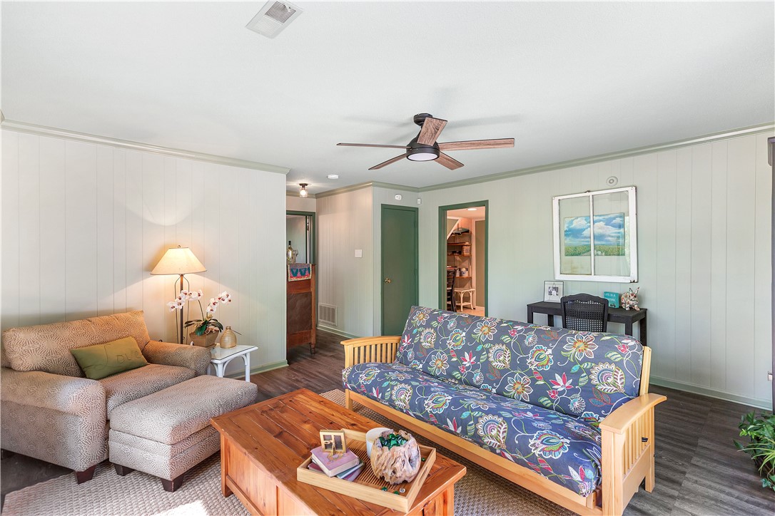 102 Rockingham Road Seneca, SC 29672 - Photo 27 of 39 This inviting living area features warm wood flooring and a classic ceiling fan, perfect for relaxed gatherings.