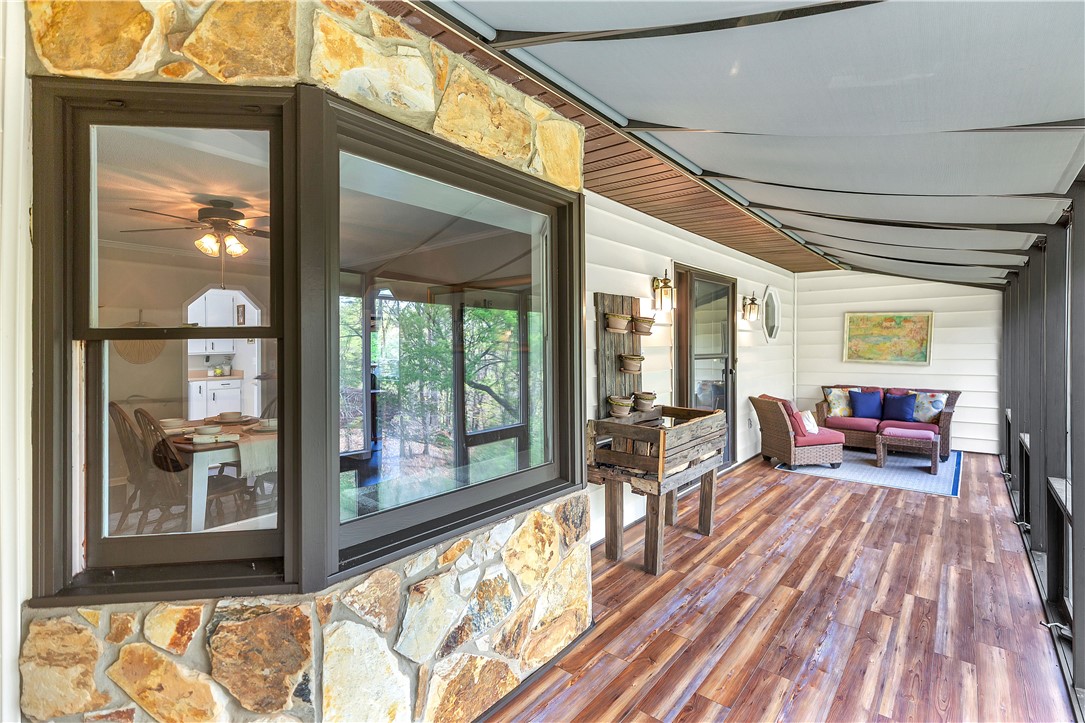 102 Rockingham Road Seneca, SC 29672 - Photo 3 of 39 This inviting patio features durable flooring and ample space for comfortable outdoor living and entertaining.