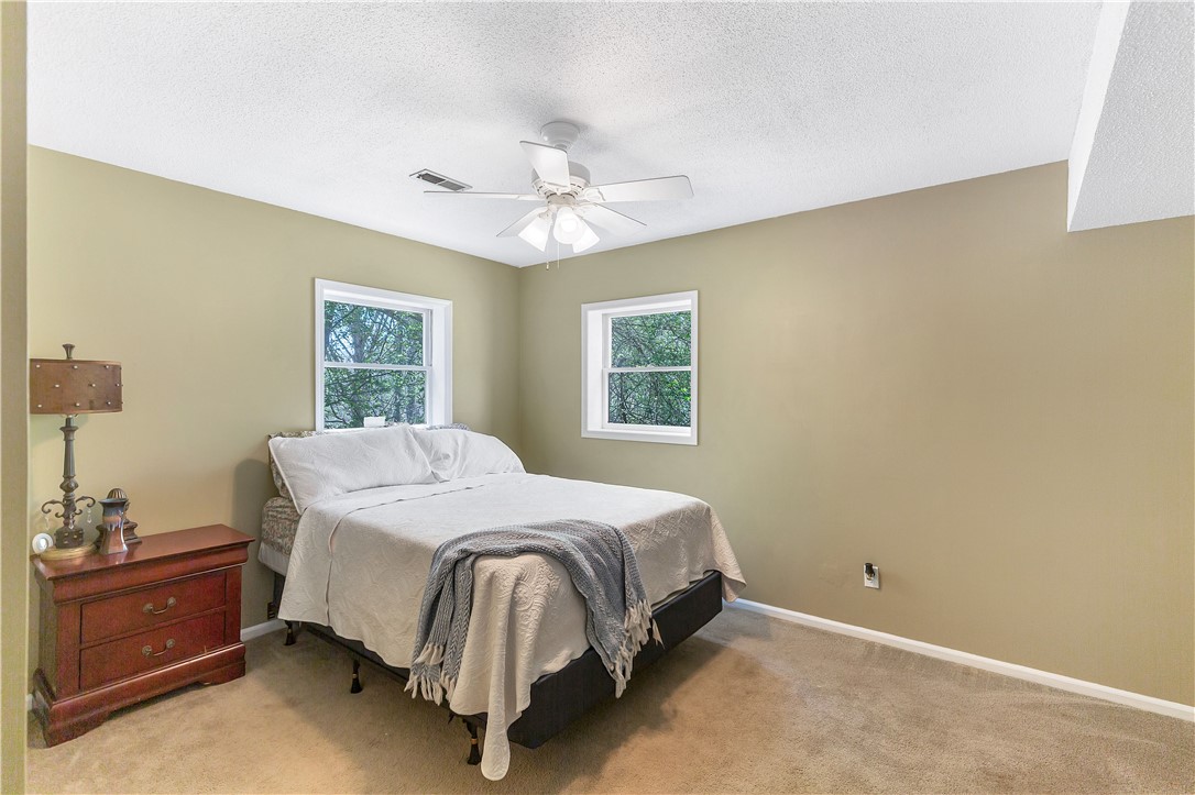 102 Rockingham Road Seneca, SC 29672 - Photo 31 of 39 This inviting bedroom provides a comfortable retreat with ample natural light.