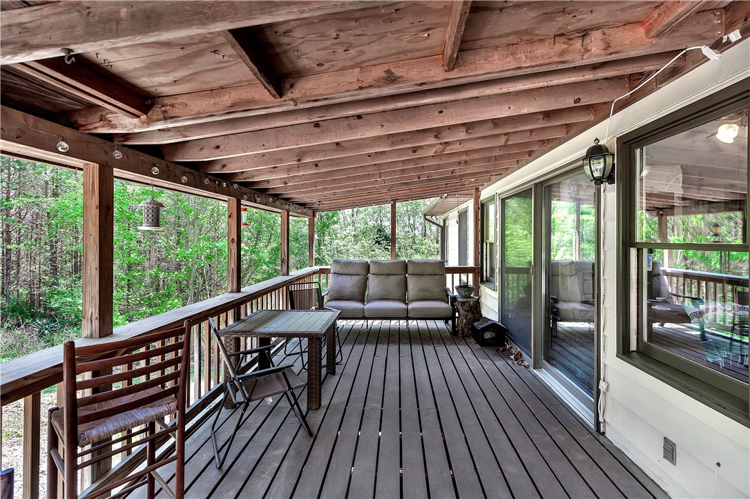 102 Rockingham Road Seneca, SC 29672 - Photo 33 of 39 This spacious deck provides an idyllic setting for outdoor relaxation and entertaining amidst natural surroundings.