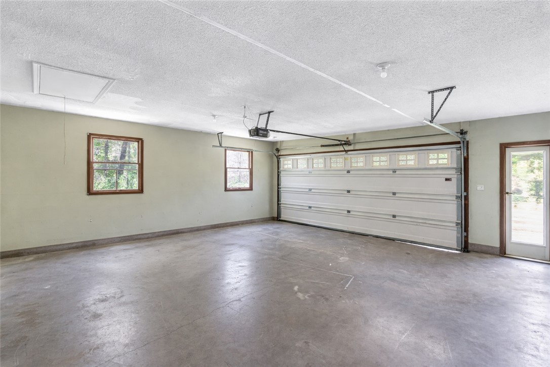 102 Rockingham Road Seneca, SC 29672 - Photo 35 of 39 This spacious garage offers ample room and direct access to the outdoors.