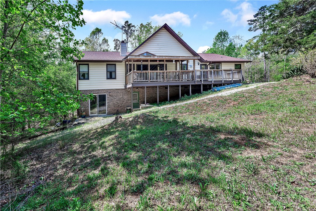 102 Rockingham Road Seneca, SC 29672 - Photo 37 of 39 This charming home offers expansive outdoor living with a spacious deck and natural surroundings.