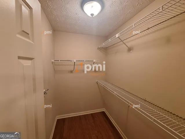 a view of a room with racks on the wall