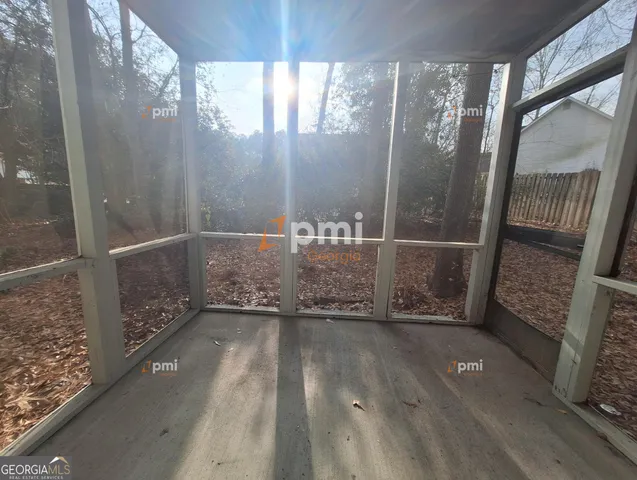 a view of balcony with wooden floor