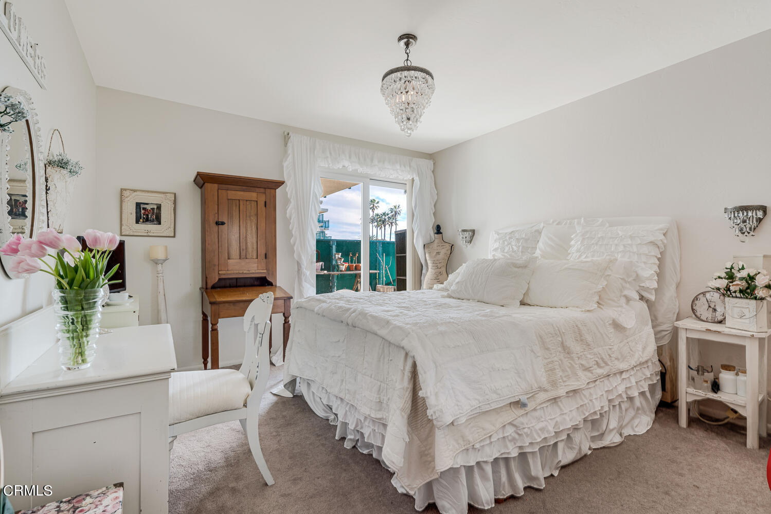 2901 Peninsula Road, Unit 134 Oxnard, CA 93035 - Photo 12 of 31 a bedroom with a bed and a potted plant