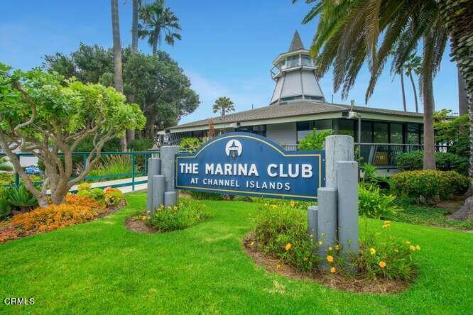2901 Peninsula Road, Unit 134 Oxnard, CA 93035 - Photo 19 of 31 a view of a street sign under a large tree