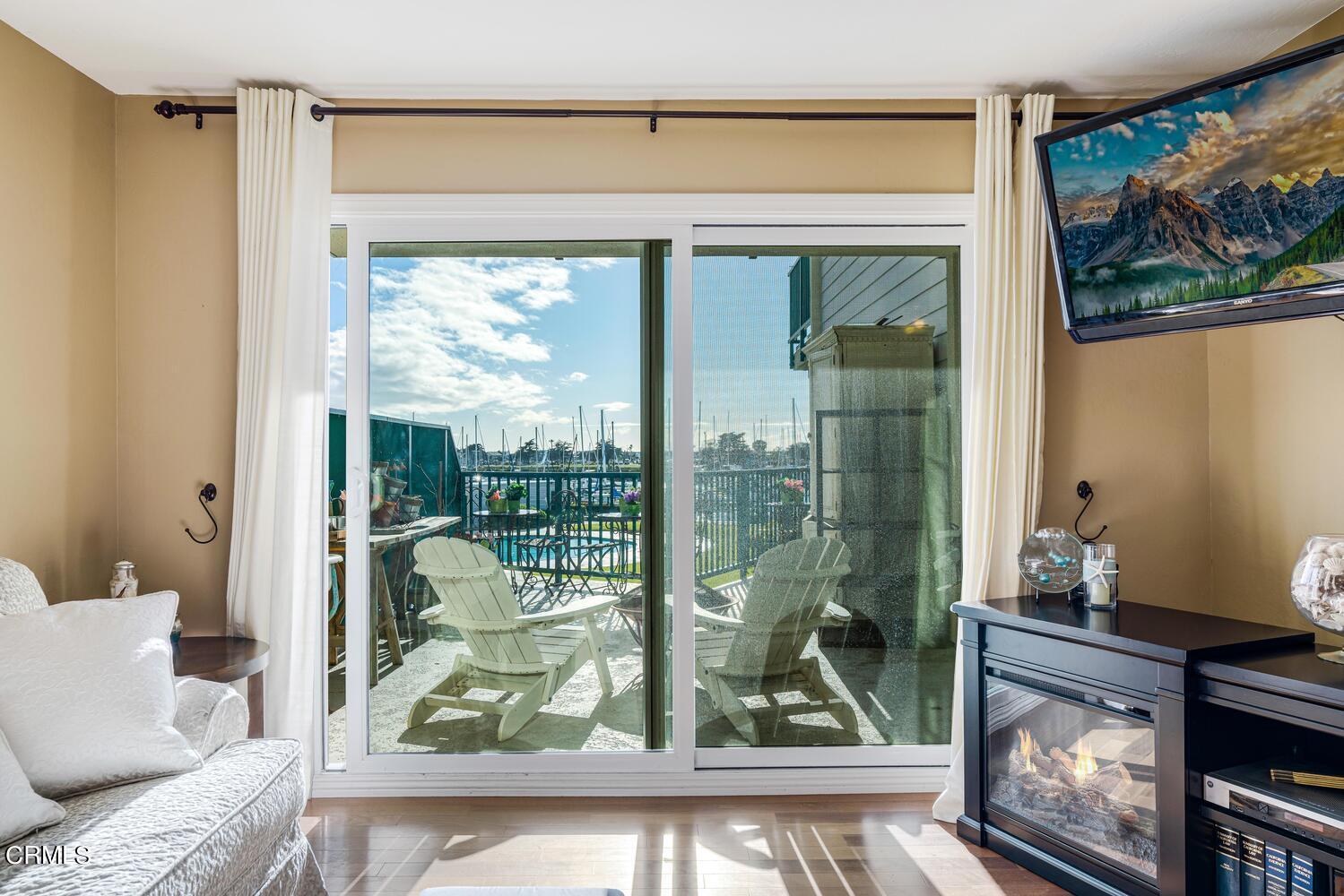2901 Peninsula Road, Unit 134 Oxnard, CA 93035 - Photo 6 of 31 a living room with a large window and a table