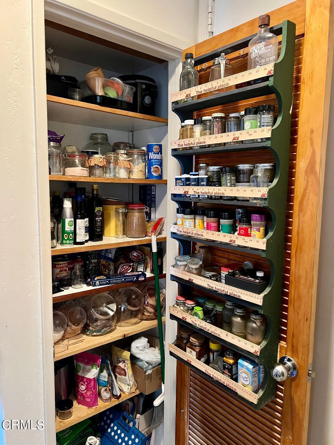 2901 Peninsula Road, Unit 134 Oxnard, CA 93035 - Photo 9 of 31 a shelf with wine bottles and glasses