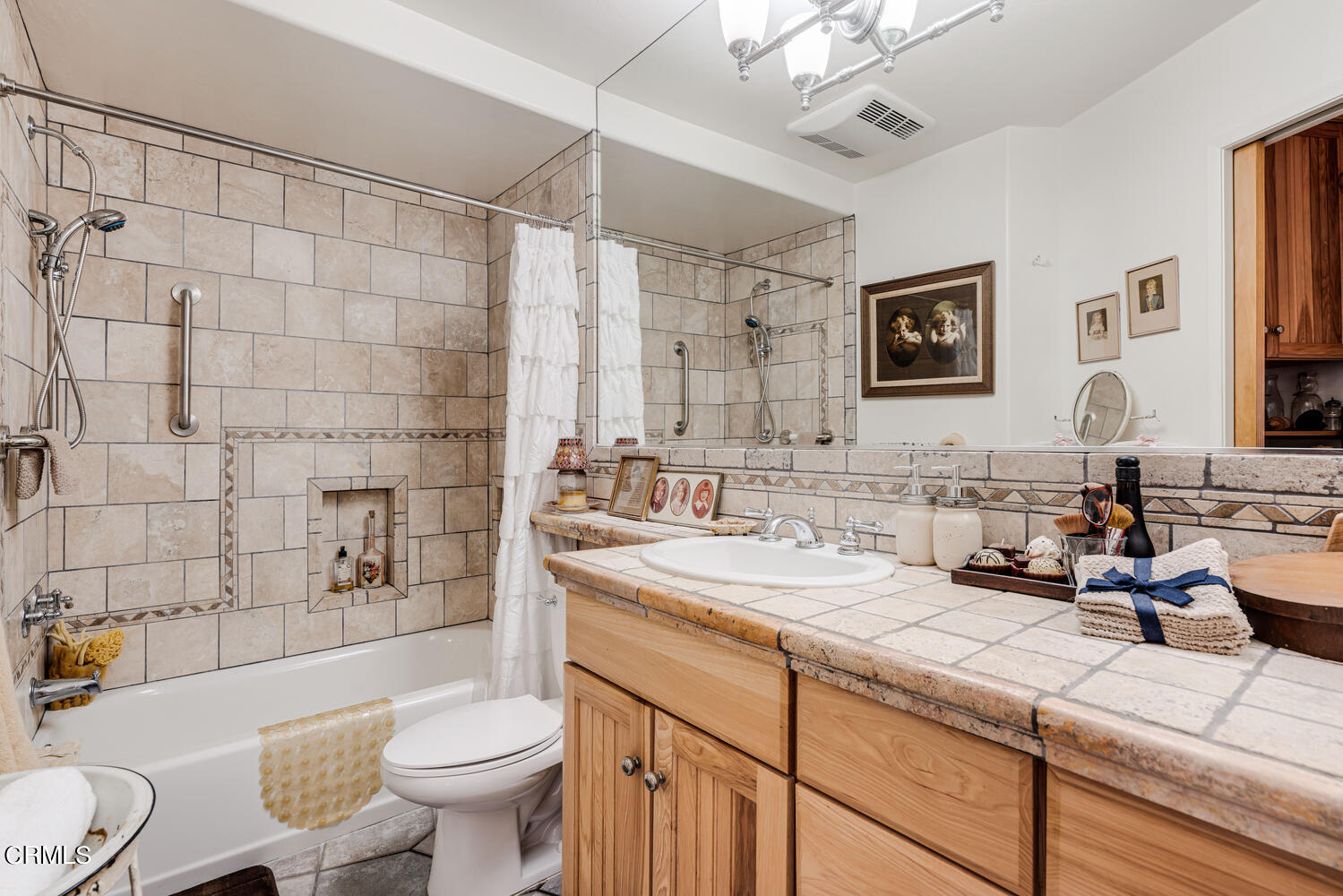 2901 Peninsula Road, Unit 134 Oxnard, CA 93035 - Photo 10 of 31 a bathroom with a double vanity sink toilet mirror and shower