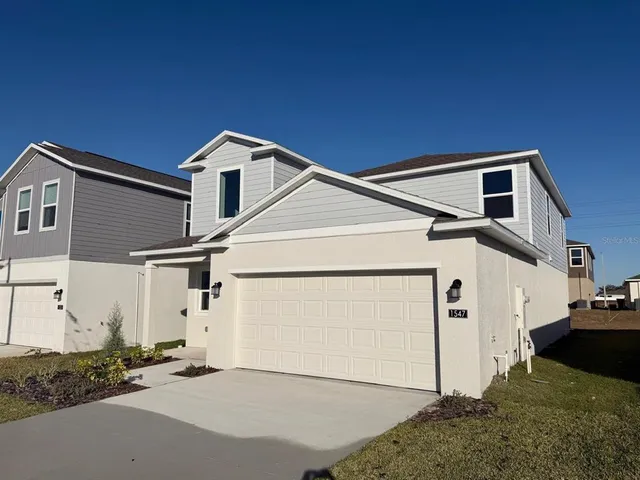 a house with white door of garage