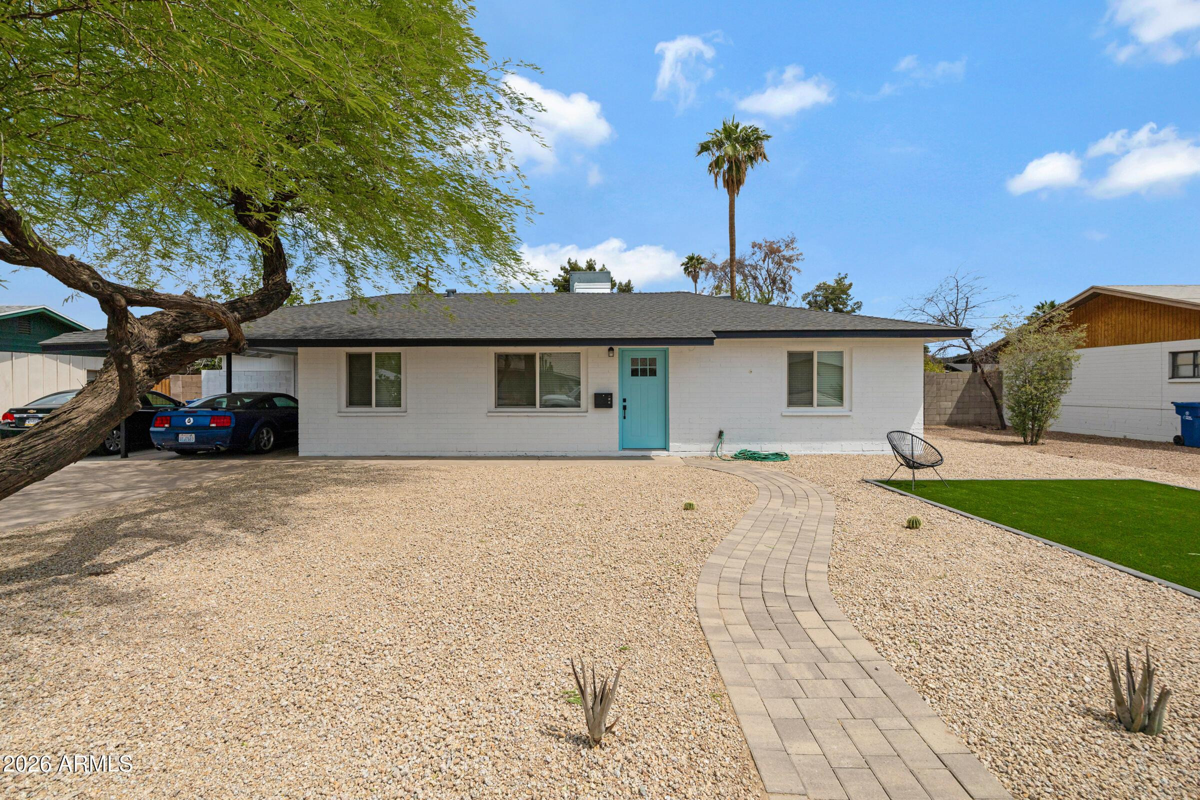 536 West 18th Street Tempe, AZ 85281 - Photo 1 of 39 a view of a house with a backyard and a tree