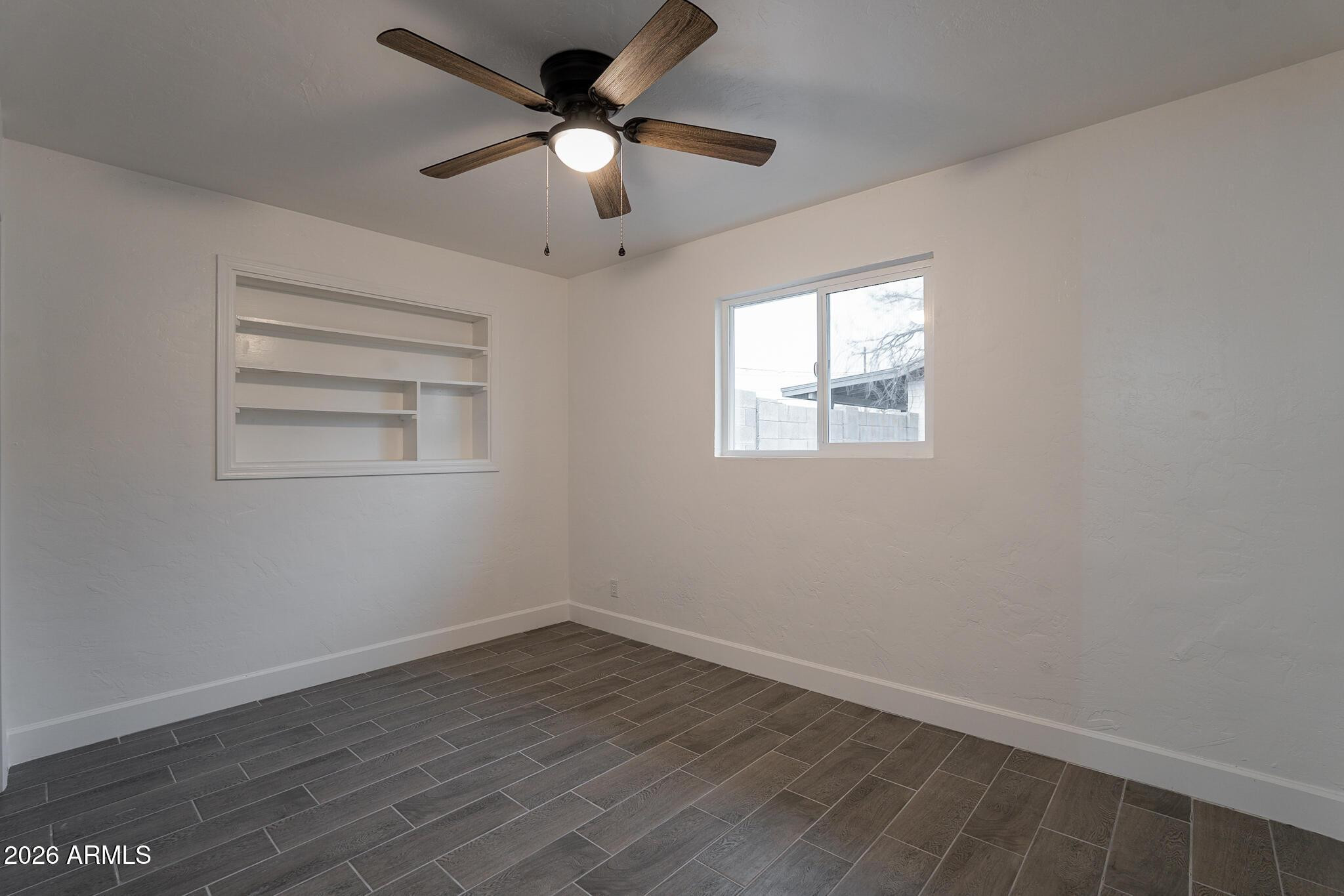 536 West 18th Street Tempe, AZ 85281 - Photo 16 of 39 an empty room with wooden floor ceiling fan and windows