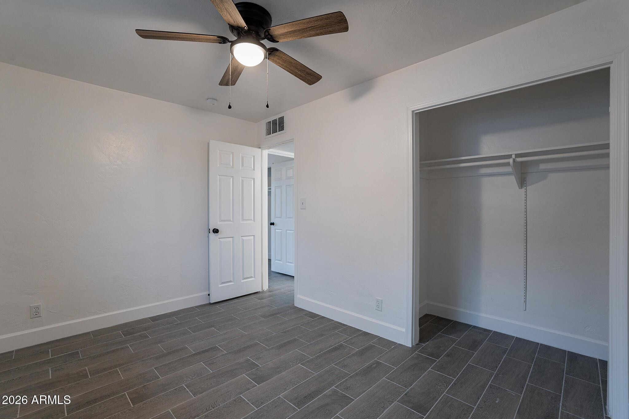 536 West 18th Street Tempe, AZ 85281 - Photo 17 of 39 a view of an empty room with a ceiling fan